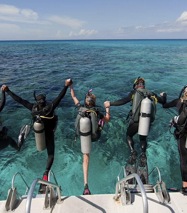 scuba-divers-enter-water-from-boat-via-giant-gaga-tours-kenya.